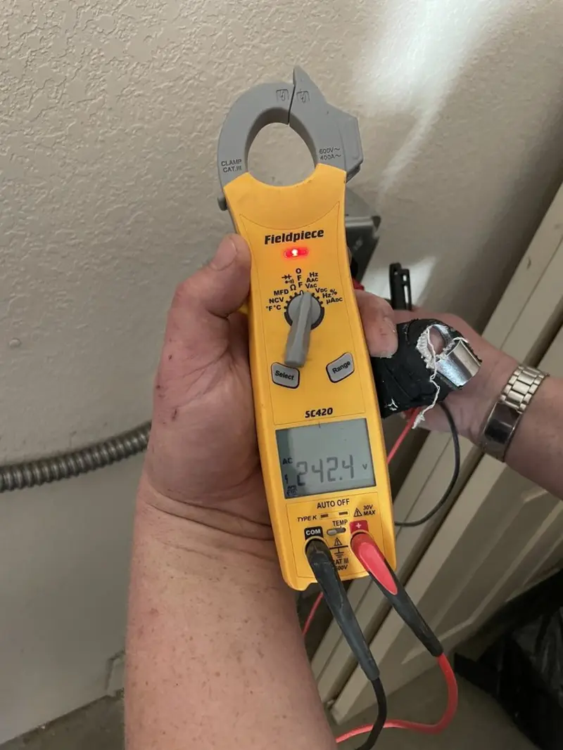Voltage testing with clamp meter during Electrical Installation Services in Fair Oaks